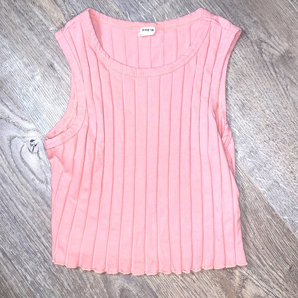 It is from SHEIN. In has indented stripes. It is like a pickish color.